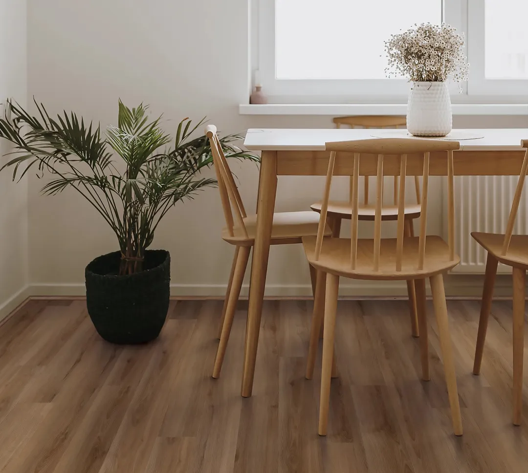 Hickory colored LVP in dining room | Sterling Carpet & Flooring