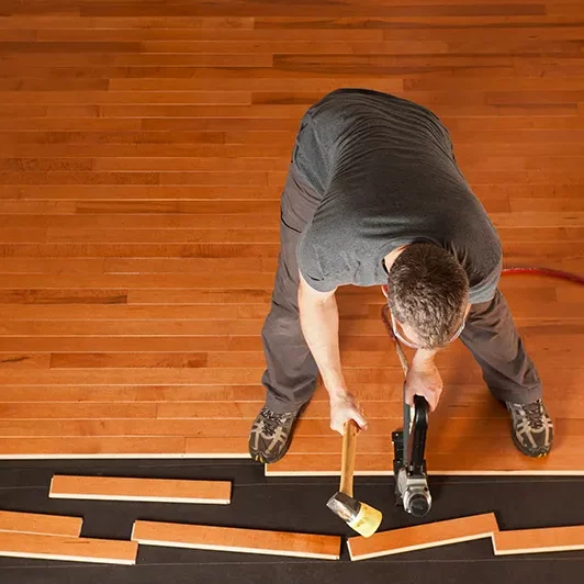 flooring-installation Worker installing flooring | Sterling Flooring